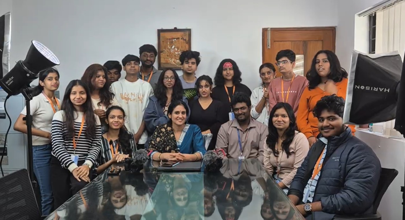 Journalism and mass communication students and faculty on set for a studio recording with professional lighting, cameras and microphones at PES University