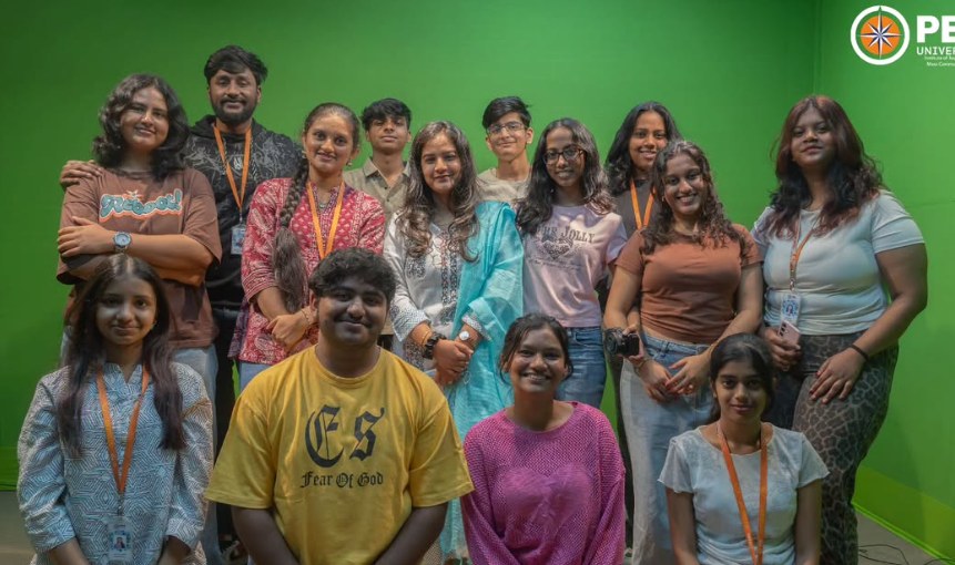 Group of journalism and mass communication students and faculty in the green-screen studio at PES University
