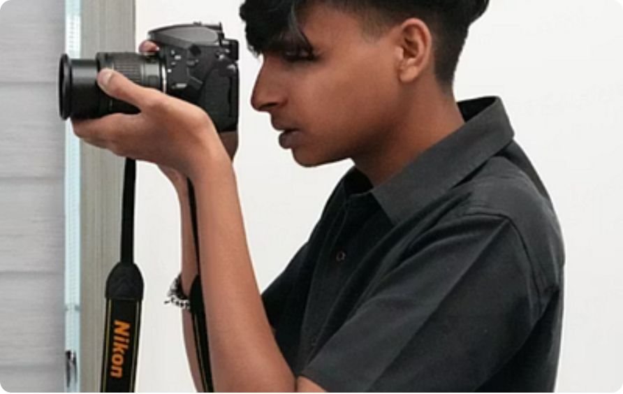 Journalism and mass communication student practising with a DSLR camera in the studio at PES University