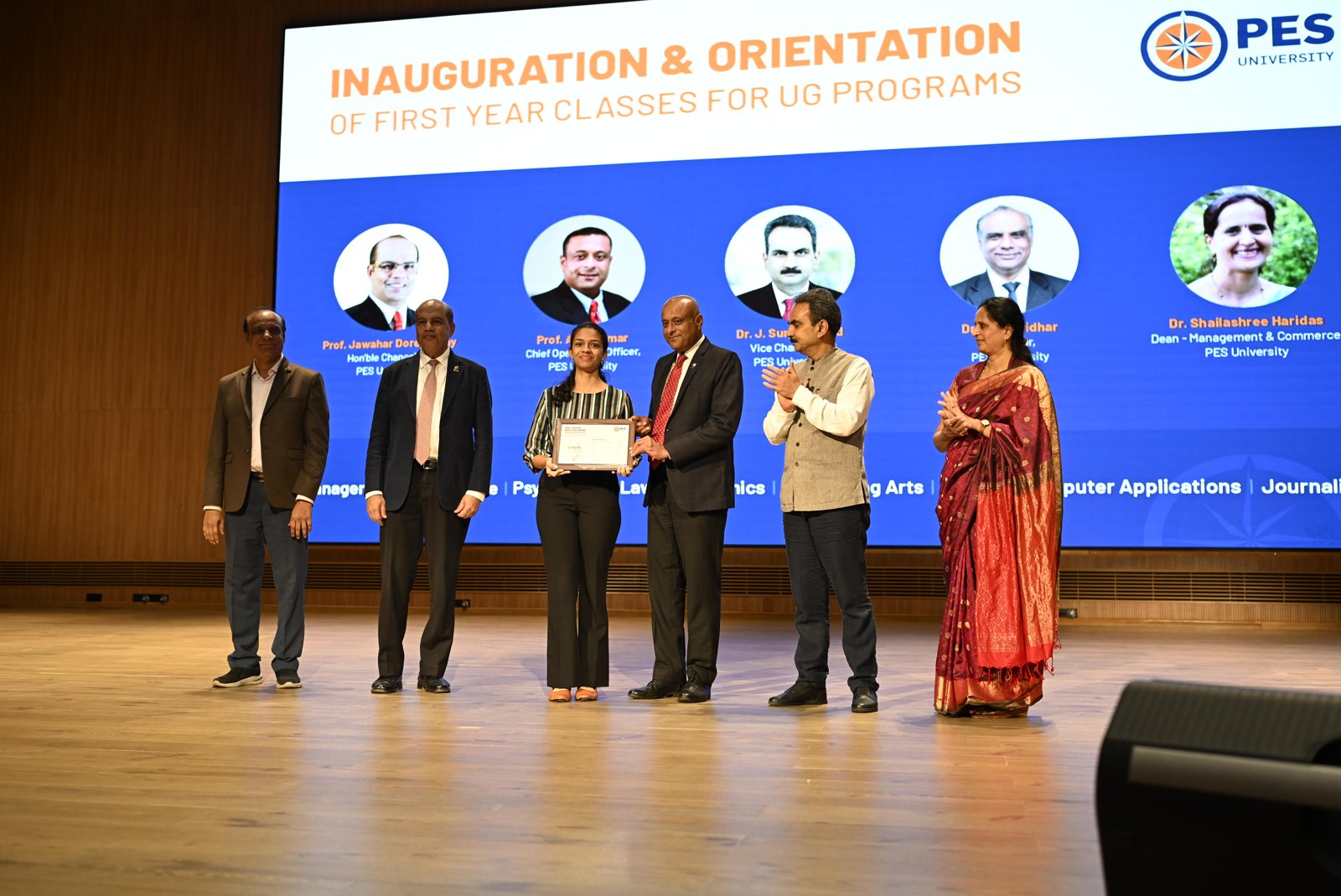 Student honoured on stage at the inauguration and orientation of first-year undergraduate programmes at PES University Bengaluru