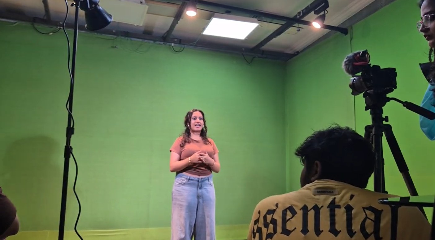 Journalism and mass communication student presenting to camera in the green-screen studio at PES University Bengaluru