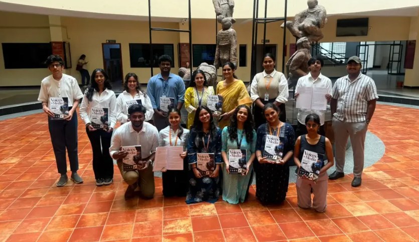 Journalism and mass communication students and faculty holding copies of the Voices of Media publication at PES University
